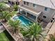 Aerial view of a sparkling pool surrounded by lush, green grass creates a backyard oasis at 15138 W Campbell Ave, Goodyear, AZ 85395