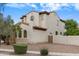 Charming two-story home with a tile roof and well-maintained landscaping on a sunny day at 16158 W Christy Dr, Surprise, AZ 85379
