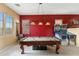 This game room offers a pool table and pinball machines, providing entertainment for all at 16158 W Christy Dr, Surprise, AZ 85379