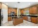 This spacious kitchen has stainless appliances, center island, and stylish tiled flooring at 16158 W Christy Dr, Surprise, AZ 85379