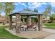 Shaded picnic area with stone pillars and picnic tables, perfect for community gatherings at 16158 W Christy Dr, Surprise, AZ 85379