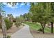 Scenic walking path with lush landscaping and shade trees, ideal for leisurely strolls at 16158 W Christy Dr, Surprise, AZ 85379