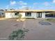 Spacious backyard with lush greenery, ample space for outdoor activities, and a well-maintained exterior at 17405 N 19Th Dr, Phoenix, AZ 85023