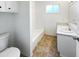 Clean, well-lit bathroom with a bathtub, toilet, vanity, and a neutral color scheme for a soothing atmosphere at 17405 N 19Th Dr, Phoenix, AZ 85023