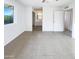 Bright bedroom featuring tiled floor, a large window with outside views and a bathroom at 17405 N 19Th Dr, Phoenix, AZ 85023