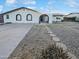 Charming single-story home featuring a white brick facade and a well-maintained front yard with stone walkway at 17405 N 19Th Dr, Phoenix, AZ 85023