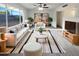 Bright living room featuring modern decor, plush seating, stylish rug, and large windows for natural light at 17405 N 19Th Dr, Phoenix, AZ 85023