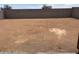 A large, empty backyard offers space for landscaping and outdoor activities at 17433 W Eva St, Waddell, AZ 85355