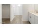 Bathroom area showcasing tiled floors and modern vanity at 17433 W Eva St, Waddell, AZ 85355