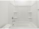 Bathroom with tub and shower combo with tiled surround at 17433 W Eva St, Waddell, AZ 85355