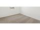 Bright bedroom featuring plush carpeting and a window view at 17433 W Eva St, Waddell, AZ 85355
