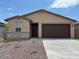 Charming single-story home features a two-car garage and well-maintained landscaping at 17433 W Eva St, Waddell, AZ 85355