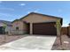 Charming single-story home features a two-car garage and well-maintained landscaping at 17433 W Eva St, Waddell, AZ 85355