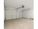 Spacious two car garage with clean concrete floors and an automatic door at 17433 W Eva St, Waddell, AZ 85355