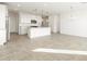 Open kitchen with a center island, granite countertops, and pendant lighting at 17433 W Eva St, Waddell, AZ 85355