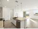 Kitchen island featuring a stainless steel dishwasher at 17433 W Eva St, Waddell, AZ 85355