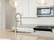 Modern kitchen with granite countertops, stainless steel appliances, and stylish pendant lighting at 17433 W Eva St, Waddell, AZ 85355