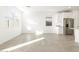 Bright and airy living room with tile flooring and lots of windows for natural light at 17433 W Eva St, Waddell, AZ 85355