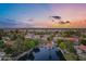 Aerial twilight view of a waterfront home in a quiet neighborhood at 175 N Brookside St, Chandler, AZ 85225