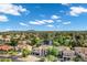 High angle view of a neighborhood, showcasing diverse architecture, lush landscaping, and scenic mountain backdrop at 175 N Brookside St, Chandler, AZ 85225