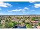 An aerial view captures a residential community featuring ponds, mature landscaping and desert vegetation at 175 N Brookside St, Chandler, AZ 85225
