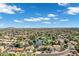 Expansive aerial view shows a community with mature trees, several ponds and manicured landscaping at 175 N Brookside St, Chandler, AZ 85225