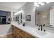 Beautiful bathroom with double vanity, new faucets, and a walk-in shower at 175 N Brookside St, Chandler, AZ 85225