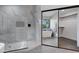 Contemporary bathroom with a soaking tub, glass-enclosed shower, and a view into the closet at 175 N Brookside St, Chandler, AZ 85225