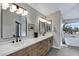Modern bathroom features double vanity sinks, quartz countertop, and neutral gray paint at 175 N Brookside St, Chandler, AZ 85225