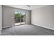 Bright bedroom features sliding glass door to balcony and neutral decor at 175 N Brookside St, Chandler, AZ 85225