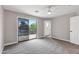 Bright bedroom features sliding glass door to balcony and neutral decor at 175 N Brookside St, Chandler, AZ 85225