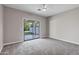 Bedroom with lots of space, carpet flooring, a sliding door that leads to a patio at 175 N Brookside St, Chandler, AZ 85225