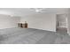 Spacious carpeted bonus room with modern wet bar area and recessed lighting at 175 N Brookside St, Chandler, AZ 85225