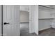 Bright walk-in closet with carpet and built in shelving units at 175 N Brookside St, Chandler, AZ 85225