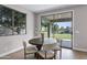 Dining area with table, chairs and view of the lake, with a sliding door leading outside at 175 N Brookside St, Chandler, AZ 85225