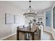 Stylish dining area features a contemporary chandelier and views into the living spaces at 175 N Brookside St, Chandler, AZ 85225