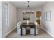 Cozy dining room with modern lighting fixtures and neutral decor, seamlessly blending style and comfort at 175 N Brookside St, Chandler, AZ 85225