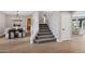 Inviting entryway with wood flooring, stairs to the upper level, and views of the dining and living areas at 175 N Brookside St, Chandler, AZ 85225