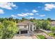 Stunning front elevation featuring a tiled roof, dual garages, mature landscaping, and ample parking space at 175 N Brookside St, Chandler, AZ 85225