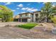 Two-story home featuring desert landscaping, a three-car garage, and a well-maintained yard at 175 N Brookside St, Chandler, AZ 85225