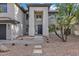 Exterior view of a two-story home with a neutral color scheme and desert landscaping at 175 N Brookside St, Chandler, AZ 85225