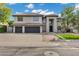 Contemporary two-story home with a three car garage and meticulously landscaped front yard at 175 N Brookside St, Chandler, AZ 85225