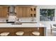 Kitchen with large island, counter seating, and lots of cabinet and counter space for cooking at 175 N Brookside St, Chandler, AZ 85225