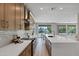Beautiful open concept kitchen with island seating and lovely backyard views at 175 N Brookside St, Chandler, AZ 85225