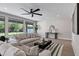 Spacious living room with a fan, table and decor, lots of natural light, and modern furniture at 175 N Brookside St, Chandler, AZ 85225