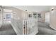 Open upstairs loft area featuring a white railing and views to the lower level at 175 N Brookside St, Chandler, AZ 85225