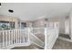 Upstairs loft area featuring a white railing and a view of the lower level at 175 N Brookside St, Chandler, AZ 85225