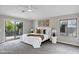 Main bedroom with plush carpet, soft light, and balcony doors at 175 N Brookside St, Chandler, AZ 85225