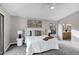 Bright main bedroom features neutral tones, carpet floors, modern lighting, and ensuite bathroom at 175 N Brookside St, Chandler, AZ 85225