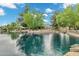Picturesque waterfront featuring calm water, mature trees, and a landscaped yard, creating a serene outdoor ambiance at 175 N Brookside St, Chandler, AZ 85225